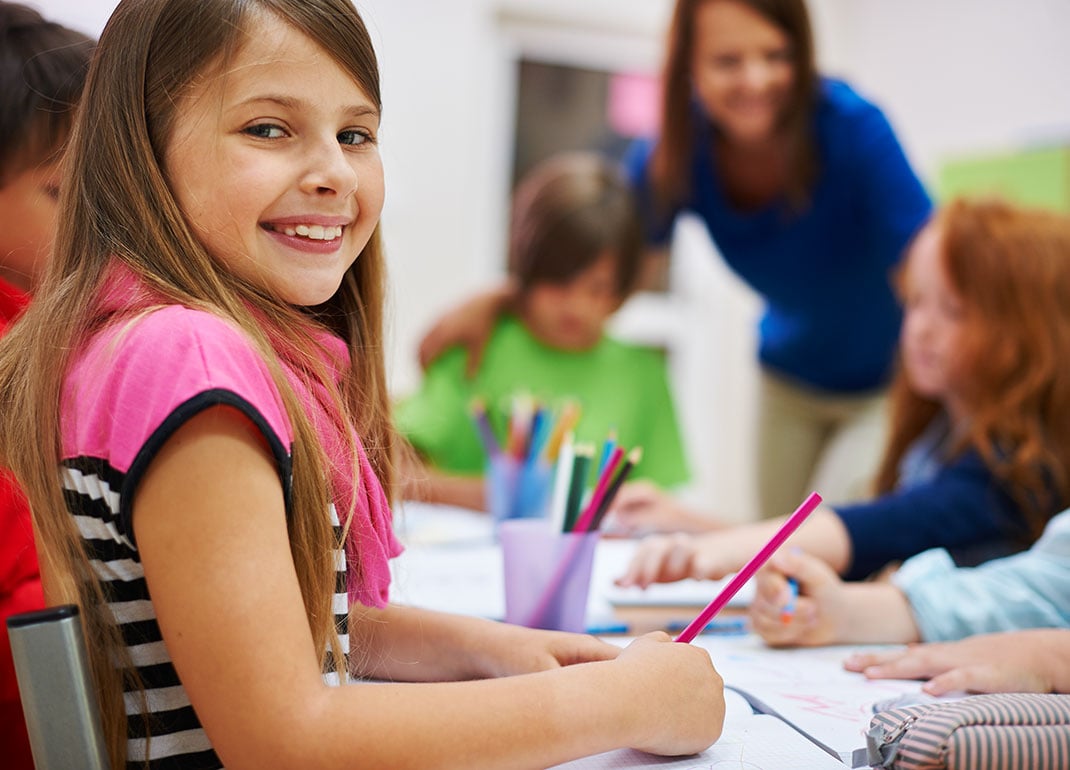 girl-at-table-with-students